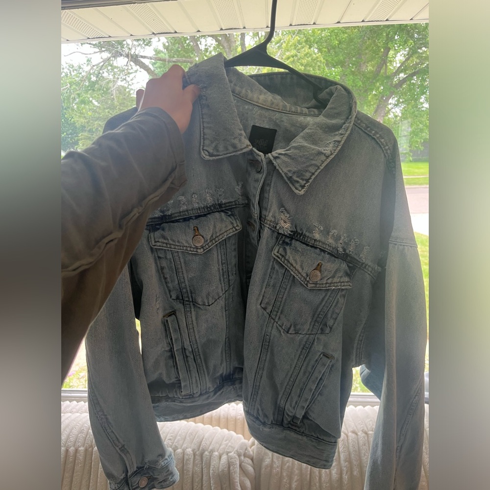 Light distressed denim jacket